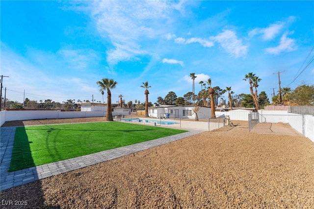 view of yard featuring a patio, a fenced backyard, and a fenced in pool