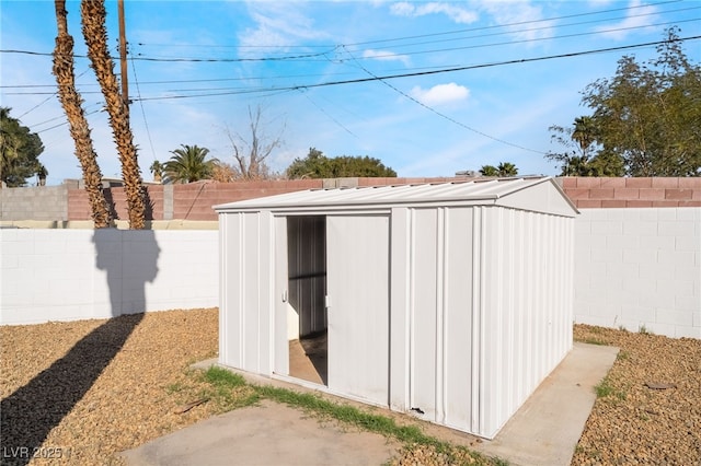 view of shed featuring a fenced backyard