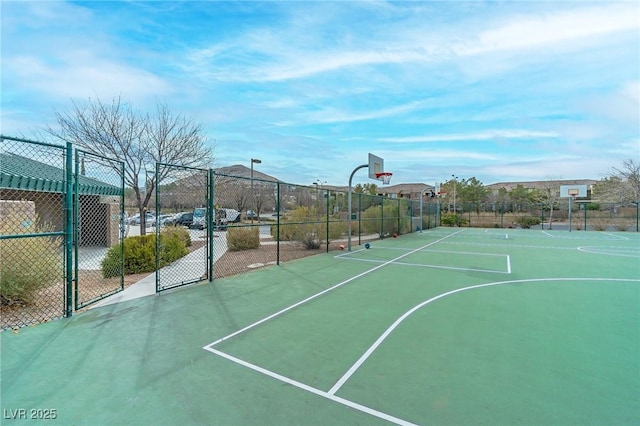 view of sport court with community basketball court and fence