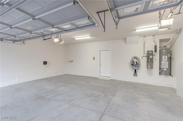 garage featuring a garage door opener and gas water heater