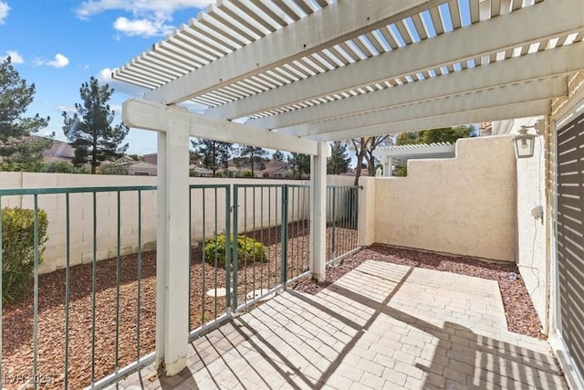 view of patio featuring a fenced backyard and a gate