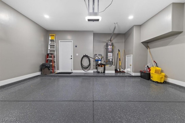 garage featuring secured water heater, baseboards, and a garage door opener