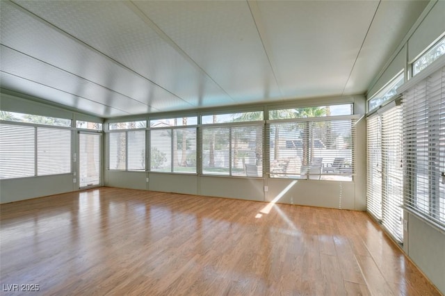 unfurnished sunroom featuring a wealth of natural light