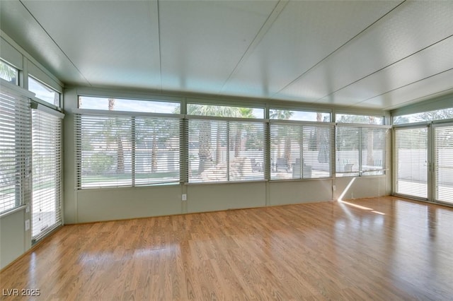 unfurnished sunroom featuring a healthy amount of sunlight