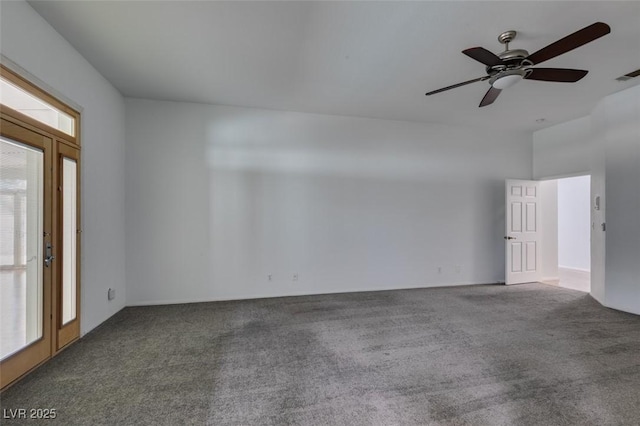 spare room with ceiling fan, carpet flooring, and a wealth of natural light