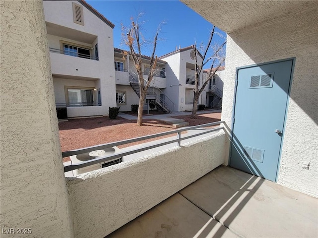 balcony with a residential view and visible vents