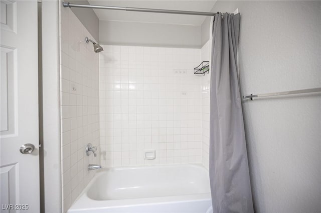 bathroom with shower / bathtub combination with curtain