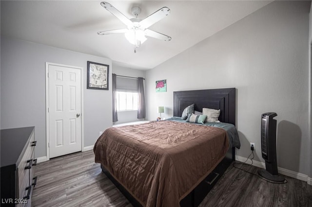 bedroom with ceiling fan, wood finished floors, lofted ceiling, and baseboards