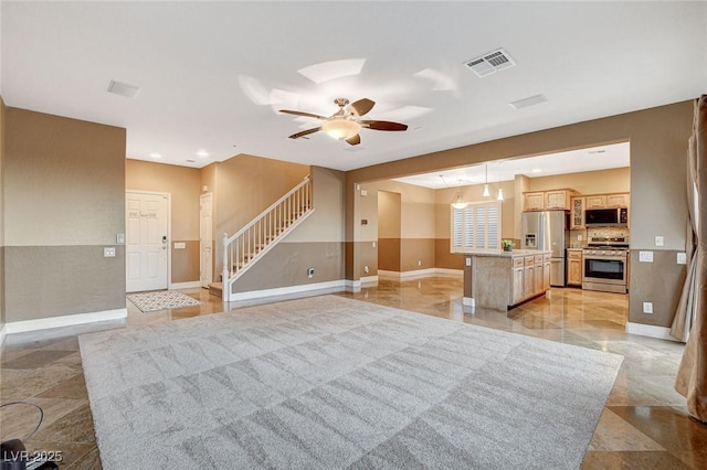 unfurnished living room featuring baseboards, visible vents, recessed lighting, ceiling fan, and stairs