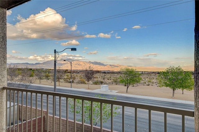 balcony featuring a mountain view