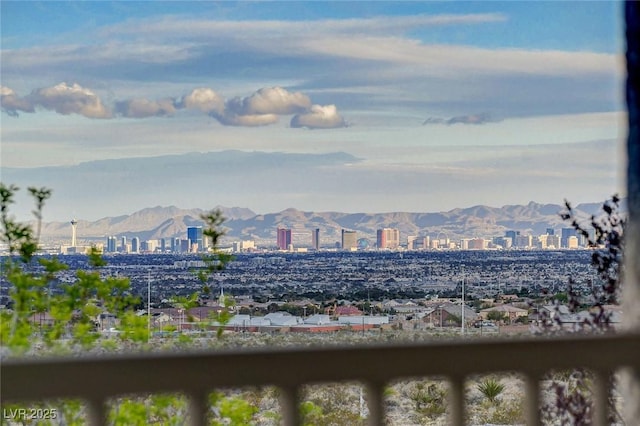 property's view of city featuring a mountain view