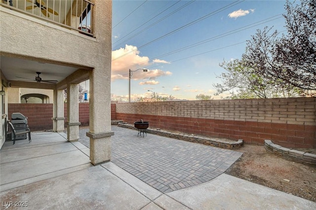 view of patio / terrace featuring a fenced backyard and a ceiling fan