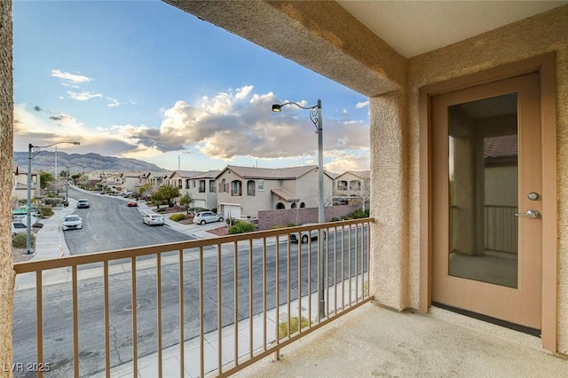 balcony featuring a mountain view and a residential view