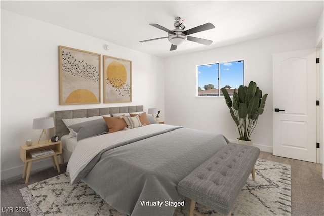 carpeted bedroom featuring a ceiling fan and baseboards