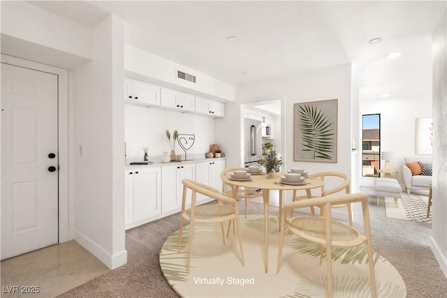 dining space featuring recessed lighting, visible vents, and baseboards