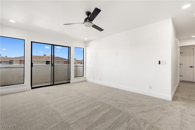 carpeted empty room featuring a ceiling fan, recessed lighting, and baseboards