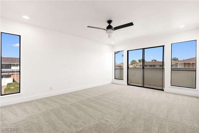 carpeted spare room with ceiling fan, baseboards, and recessed lighting