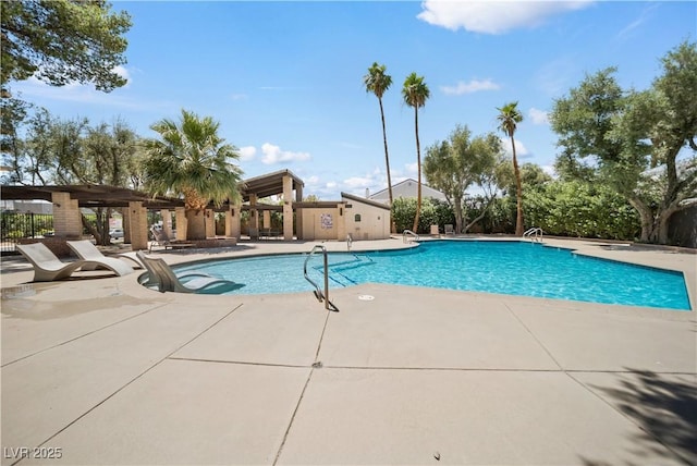 pool featuring a patio and fence