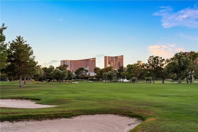 surrounding community featuring a city view and a yard