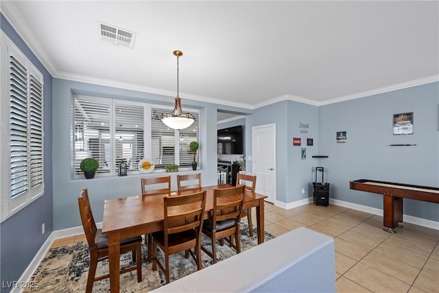 dining room with ornamental molding, visible vents, baseboards, and light tile patterned flooring