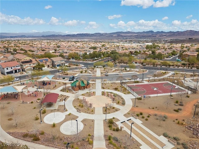 drone / aerial view featuring a residential view and a mountain view