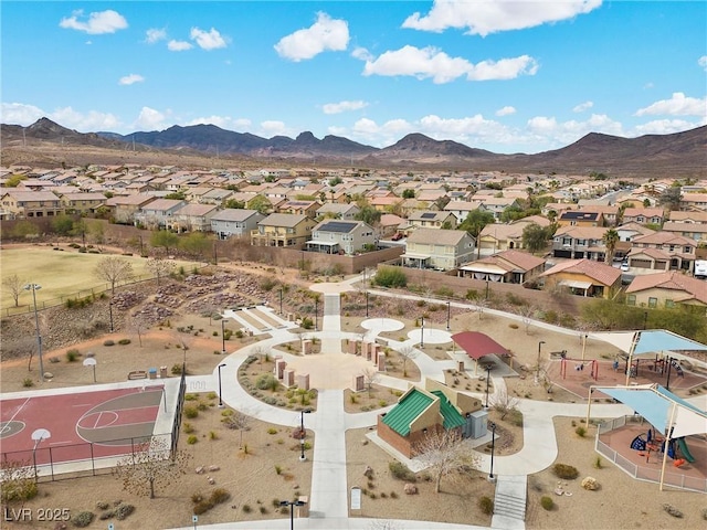 aerial view featuring a mountain view and a residential view