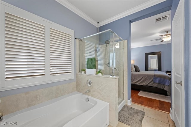 ensuite bathroom featuring crown molding, tile patterned floors, visible vents, connected bathroom, and a bath