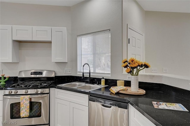 kitchen featuring white cabinets, stainless steel appliances, and a sink