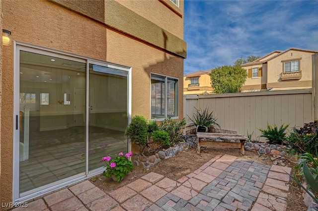 view of patio / terrace featuring fence