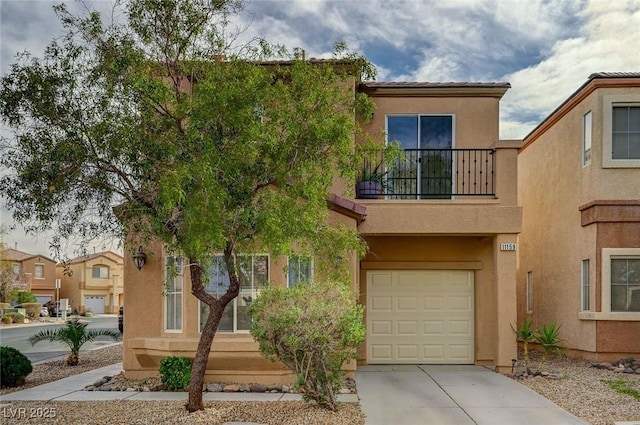 multi unit property featuring driveway, an attached garage, a balcony, and stucco siding