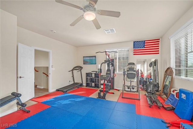 exercise area featuring a ceiling fan and visible vents