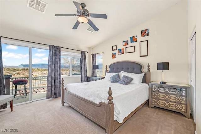 carpeted bedroom featuring lofted ceiling, a ceiling fan, access to exterior, and visible vents