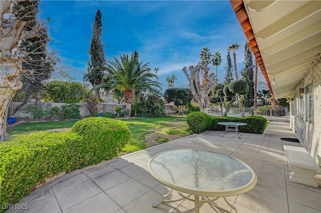 view of patio featuring fence