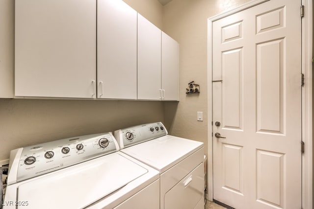 laundry room featuring cabinet space and washing machine and dryer