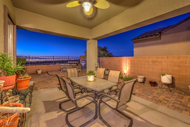 view of patio / terrace with a ceiling fan, outdoor dining space, and a fenced backyard