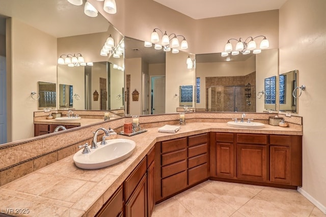 full bath featuring a stall shower, tile patterned floors, a sink, and double vanity