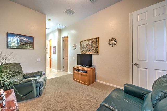 living area with carpet flooring, visible vents, and baseboards