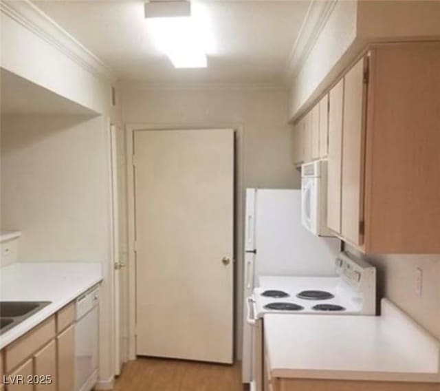 kitchen featuring white appliances, light countertops, crown molding, and light wood finished floors