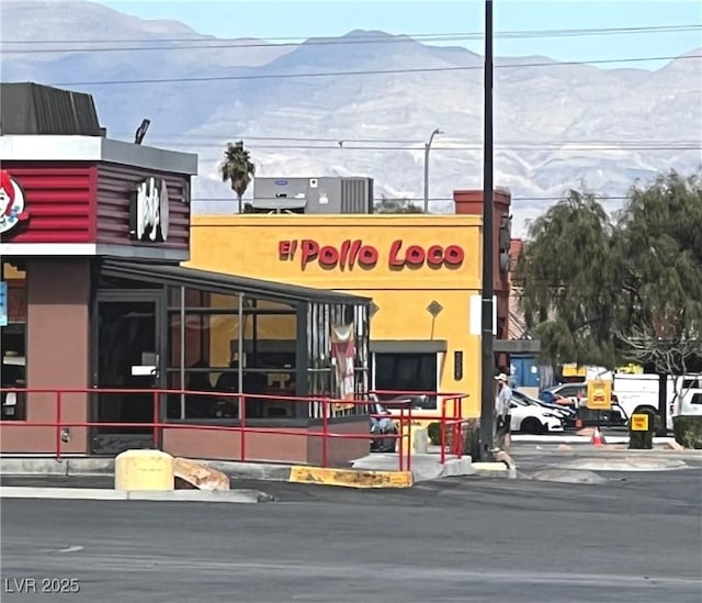 view of building exterior with a mountain view