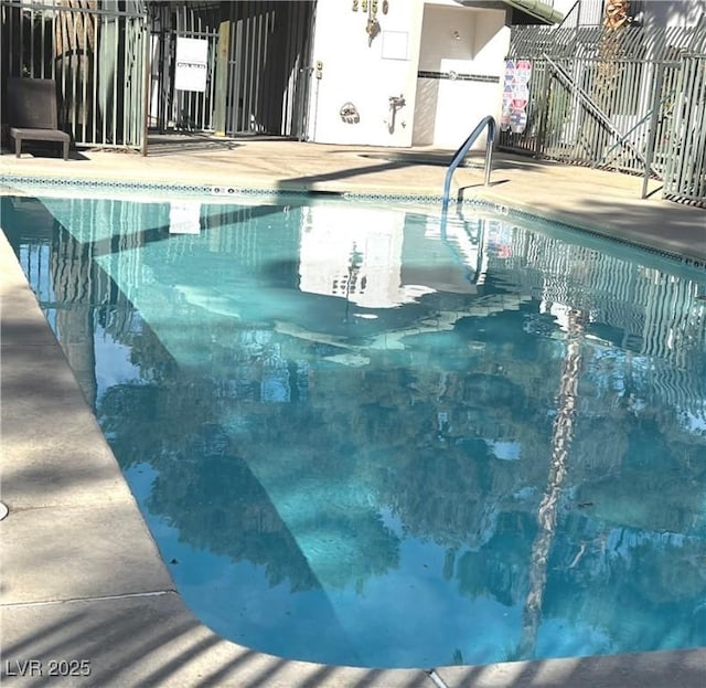 pool featuring fence