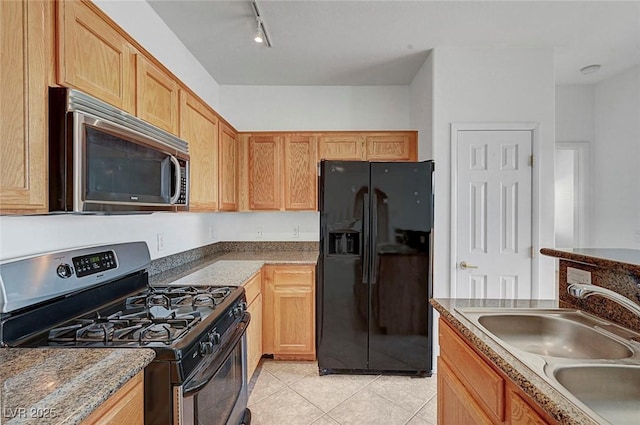 4020 Smokey Fog Ave Unit 201, North Las Vegas, NV 89081 - kitchen with appliances with stainless steel finishes, a sink, light tile patterned flooring, and rail lighting