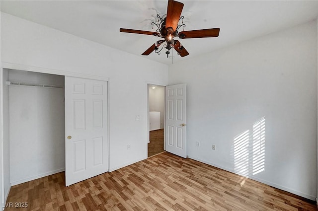 4020 Smokey Fog Ave Unit 201, North Las Vegas, NV 89081 - unfurnished bedroom with wood finished floors, a closet, baseboards, and a ceiling fan