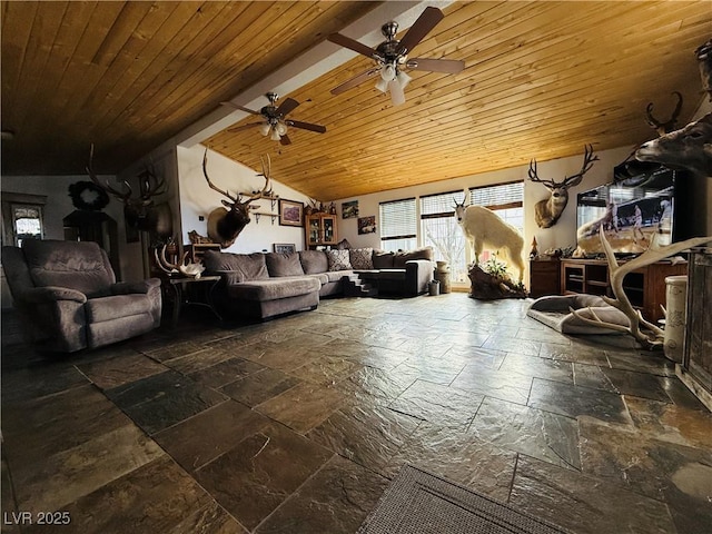 living area featuring ceiling fan, vaulted ceiling, stone tile flooring, and wooden ceiling