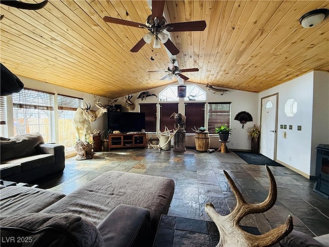 living room featuring vaulted ceiling, stone tile floors, wood ceiling, baseboards, and ceiling fan