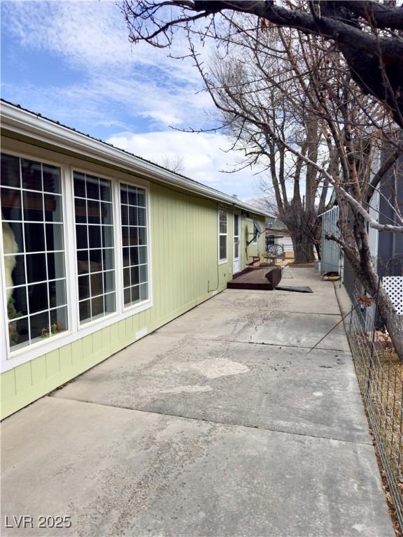 view of property exterior with a patio