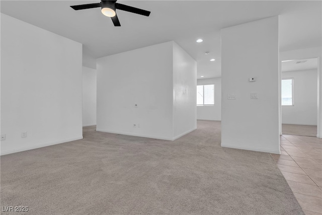 unfurnished room with light tile patterned floors, recessed lighting, light carpet, and ceiling fan