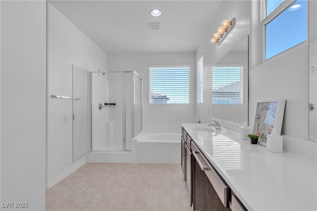 full bathroom featuring a bath, visible vents, a stall shower, and vanity