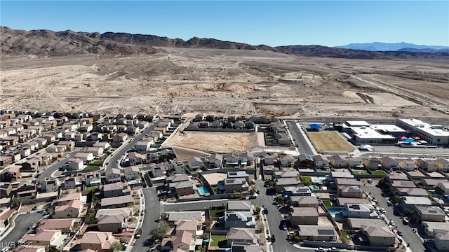 birds eye view of property with a mountain view and a residential view