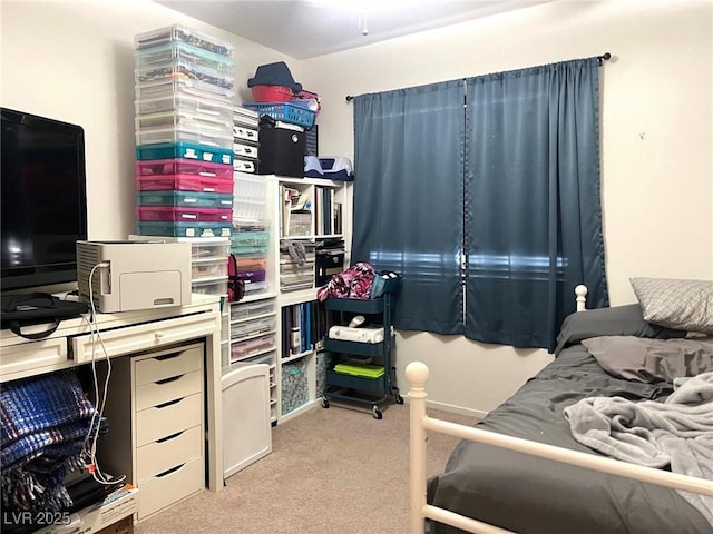 bedroom featuring light colored carpet