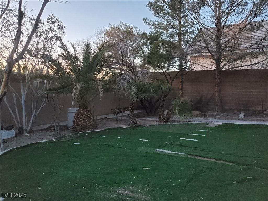 view of yard featuring a patio area and fence